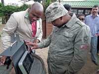 A DirectAxis employee transacts on the ViRDi reader on arrival at the company’s year-end function.